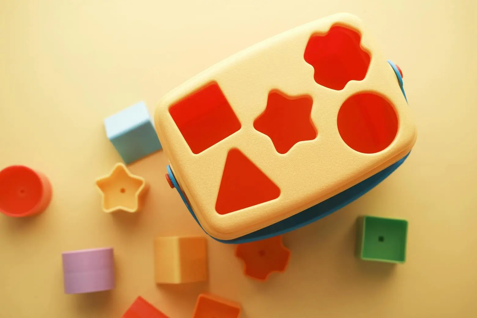 Shape sorter of multiple kinds of shapes and colors.