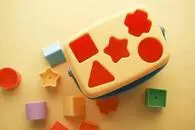 Shape sorter of multiple kinds of shapes and colors.